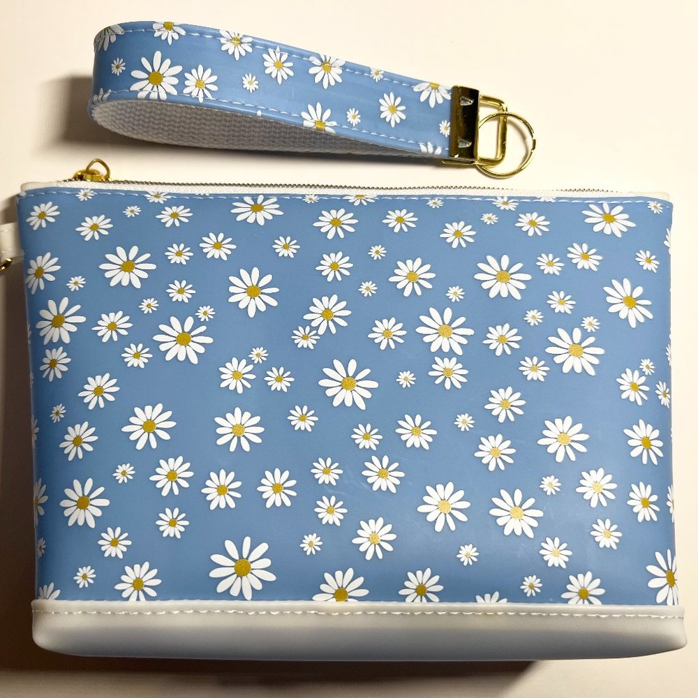 Introducing the Jelly Fabric Daisy Print Blue Makeup Bag! 8.5”W x 5.5”H
